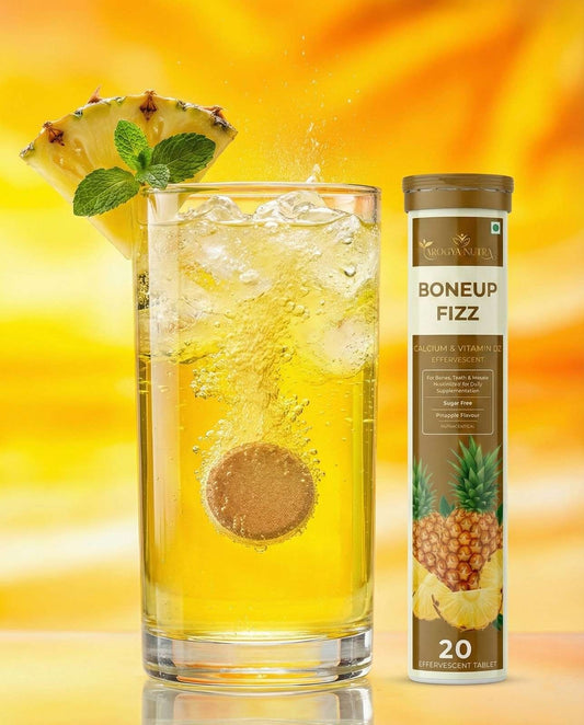 Glass of pineapple-flavored drink with a pineapple wedge and ice cubes, next to a bottle labeled 'Boneup Fizz' on a yellow background.