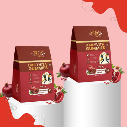 Two packages of Dailvita Gummies on a pink and gray gradient background with pomegranate graphics.