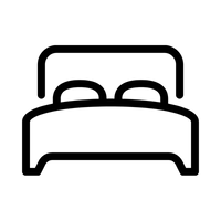 Black line drawing of a bed with two pillows on a white background