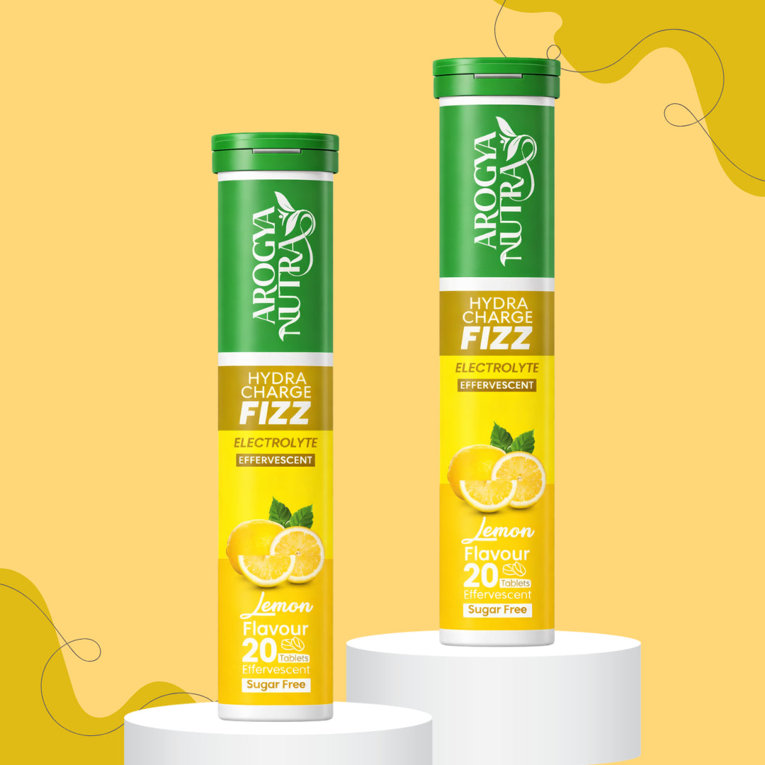 Two Tubes of HydraCharge Fizz with Yellow Lemon on a Light Yellow background