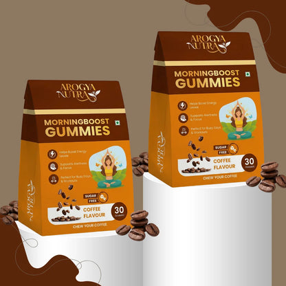 Two packages of Arogya Nature Morningboost Gummies on a white background with coffee beans.