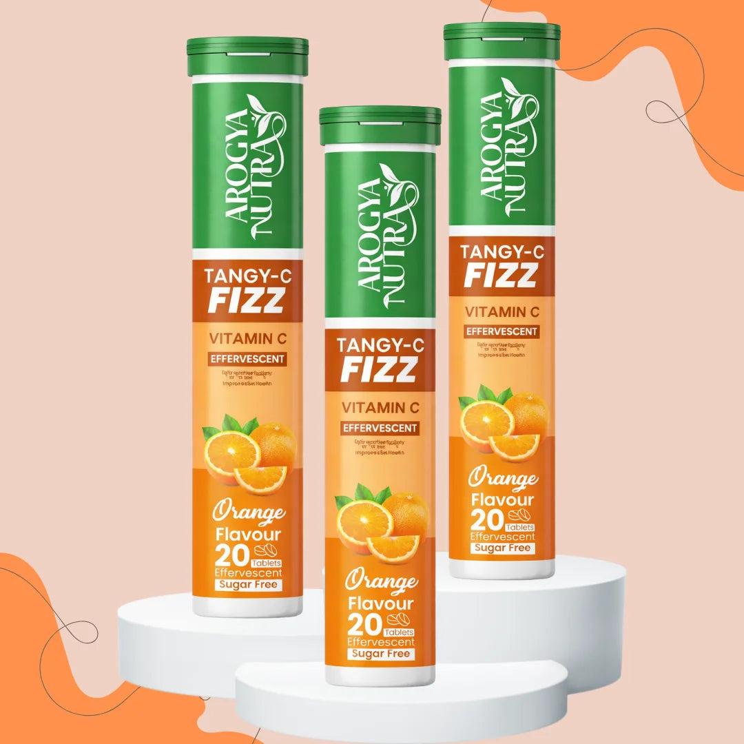 Three bottles of Tangy-C Fizz Vitamin C supplement on a peach background